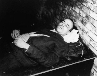 October 1946, Nuremberg, Germany --- The corpse of Nazi war criminal Hans Frank after his execution by hanging. Frank, the governor of Poland after its invasion in 1939, was judged guilty of war crimes and crimes against humanity in the Nuremburg trials. October 1946. --- Image by © CORBIS