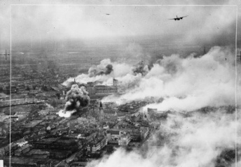Operation OYSTER, the daylight attack on the Philips radio and valve works at Eindhoven, Holland, by No. 2 Group. Douglas Bostons fly over the burning Emmasingel lamp and valve factory at the height of the raid. The works were so severely hit that full production was not resumed for six months. C 5755 Part of AIR MINISTRY SECOND WORLD WAR OFFICIAL COLLECTION No. 2 Group RAF