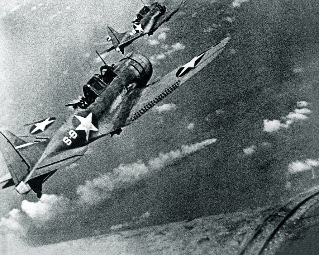 1024px-SBD-3_Dauntless_bombers_of_VS-8_over_the_burning_Japanese_cruiser_Mikuma_on_6_June_1942